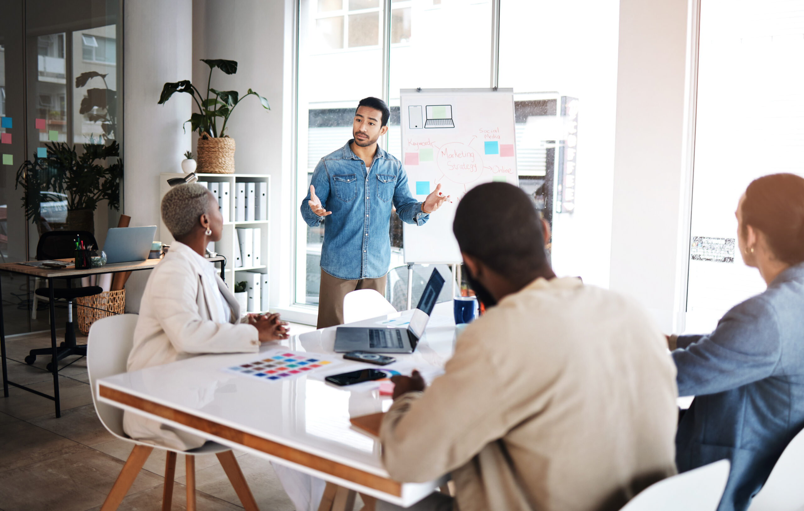 A stock photo of a group of colleagues in a meeting