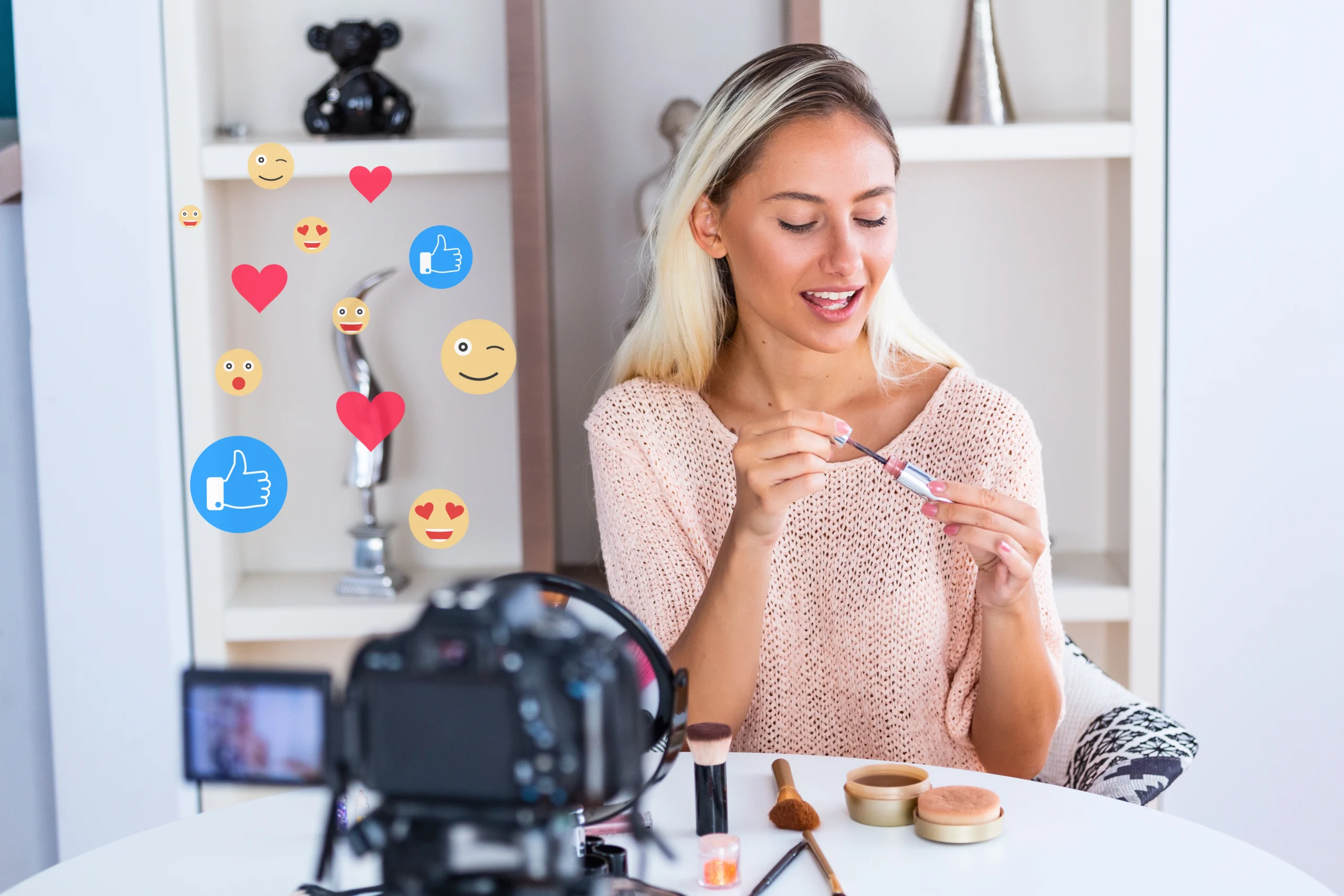 A stock photo of an influencer showing off a product in front of a camera