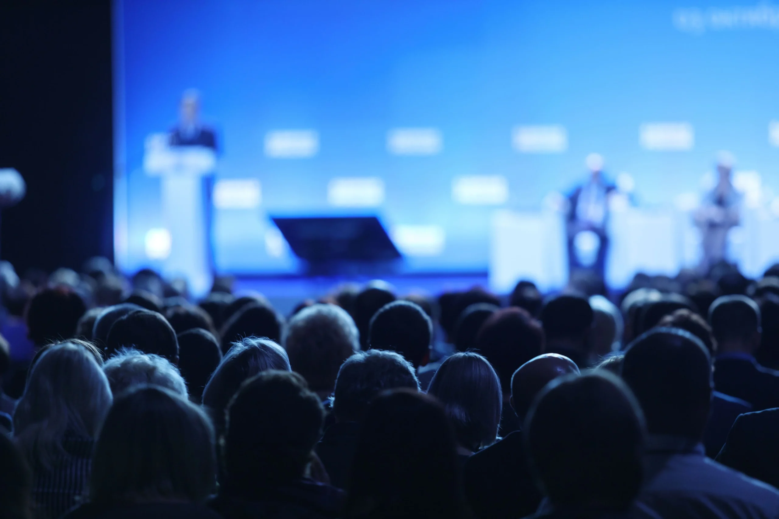An image of a group of people sitting in a session at a market research conference