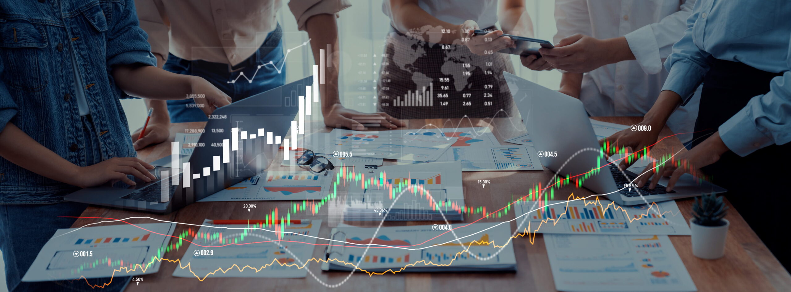 A team in the background with graphical data in the foreground.